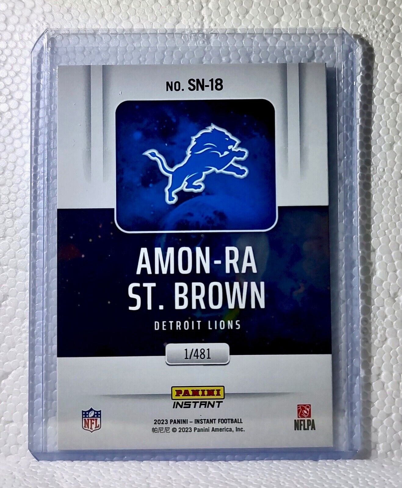 Amon-Ra St. Brown 2023 Panini NFL #18 Supernova Football Card Lions 1/481