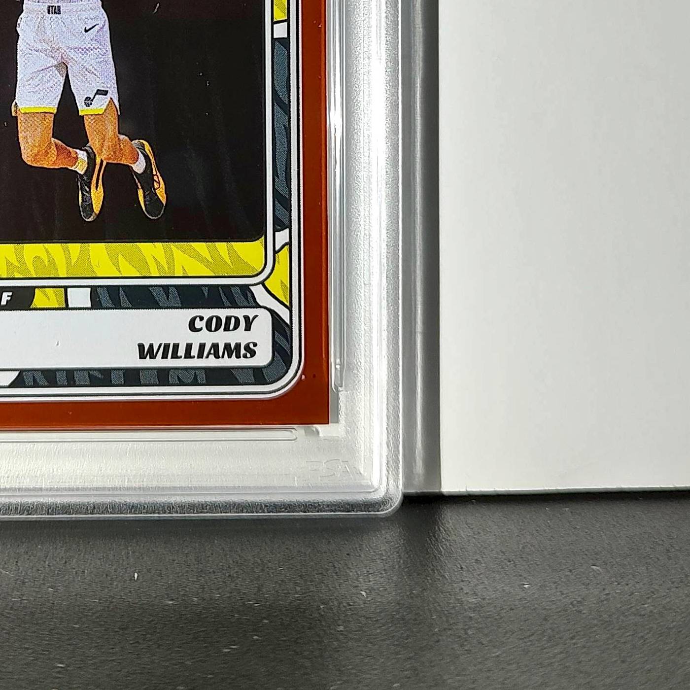 Cody Williams Rookie 2024-25 Panini NBA #99 Sticker 4/50 Orange Foil PSA 7 NM