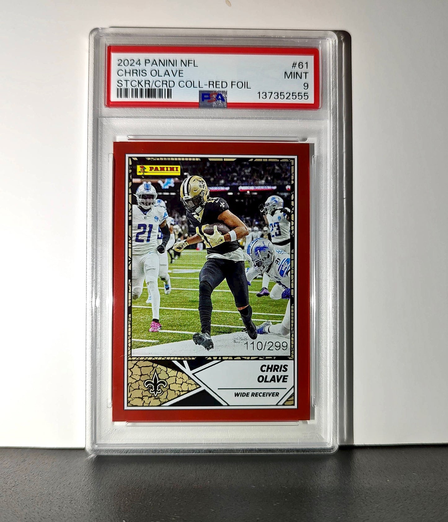 Chris Olave 2024 Panini Sticker Collection 110/299 #61 Red Foil PSA 9 Mint