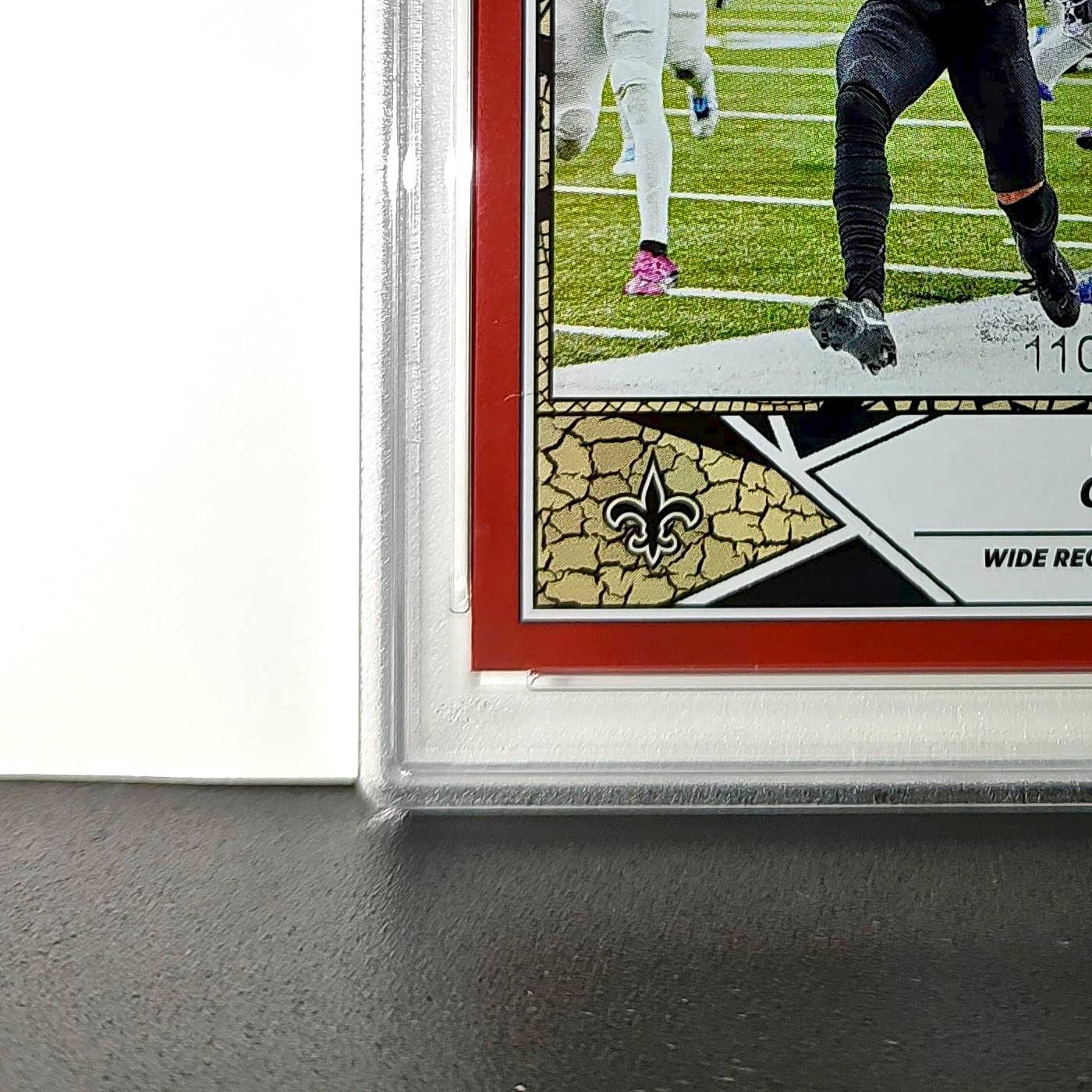 Chris Olave 2024 Panini Sticker Collection 110/299 #61 Red Foil PSA 9 Mint