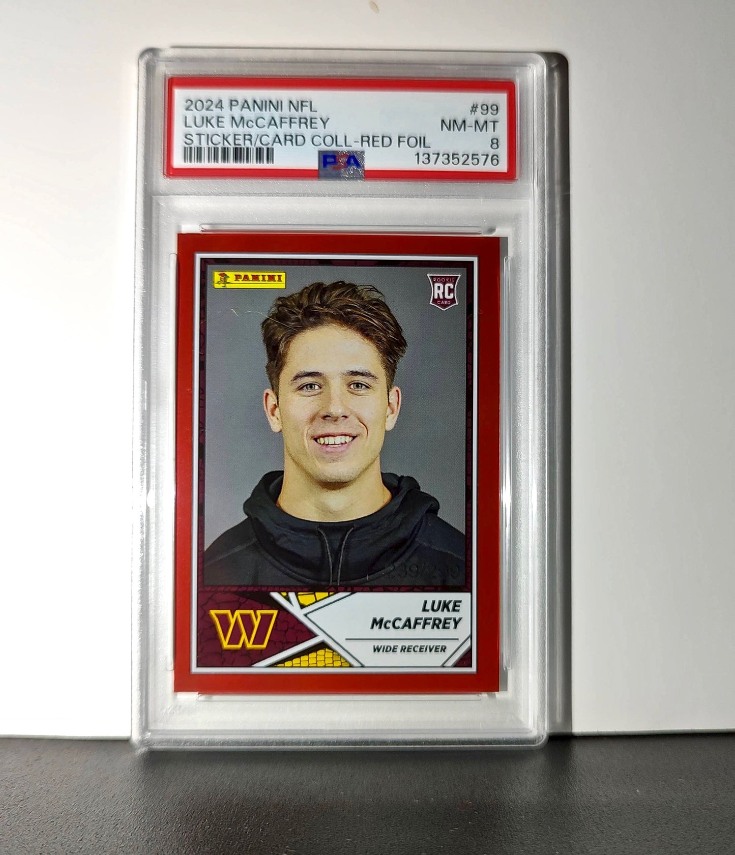 Luke McCaffrey 2024 Panini Sticker Collection 239/299 #99 Rookie Red Foil PSA 8