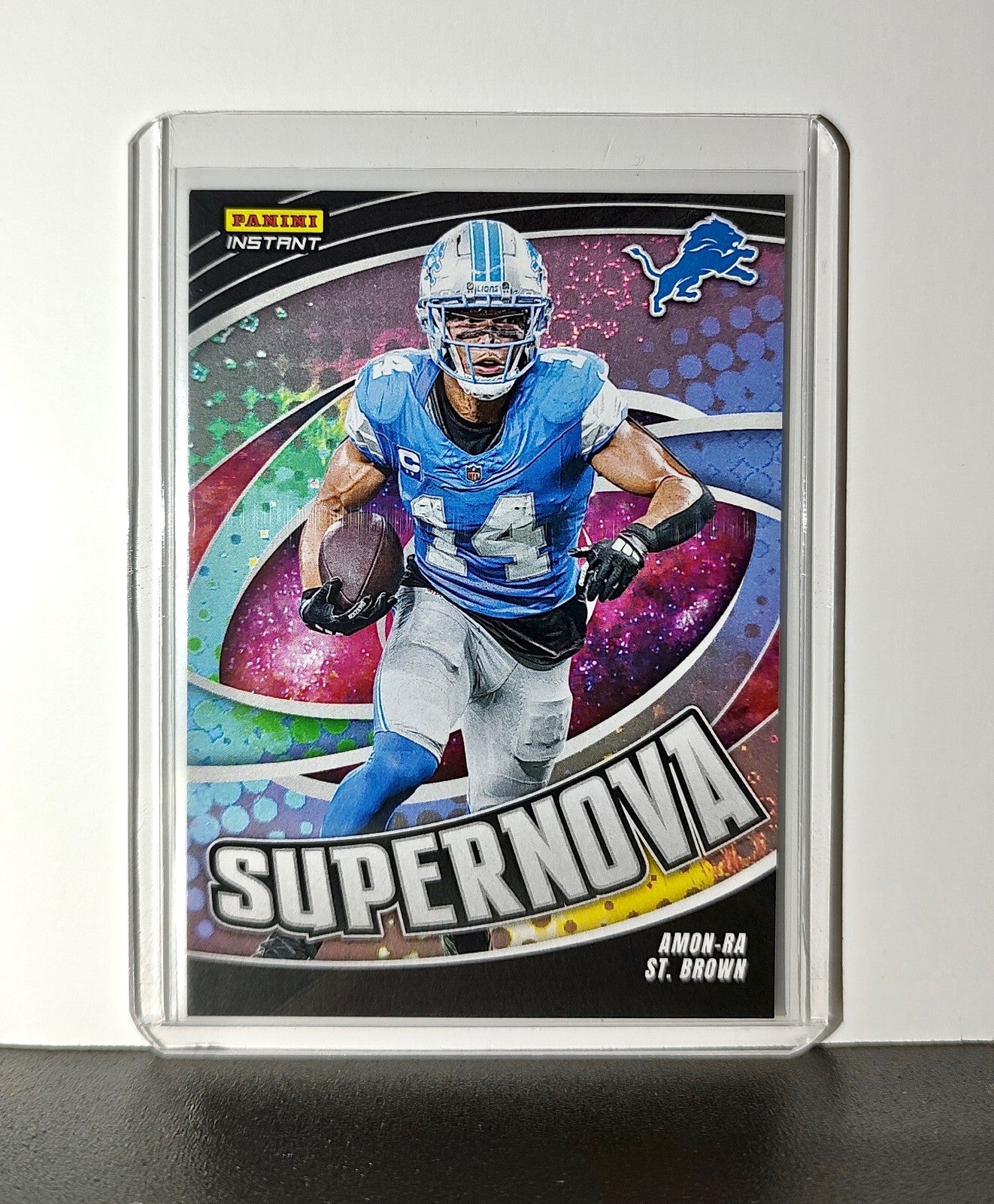 Amon-Ra St. Brown 2024 Panini Supernova NFL #8 Football Card Detroit Lions 1/451