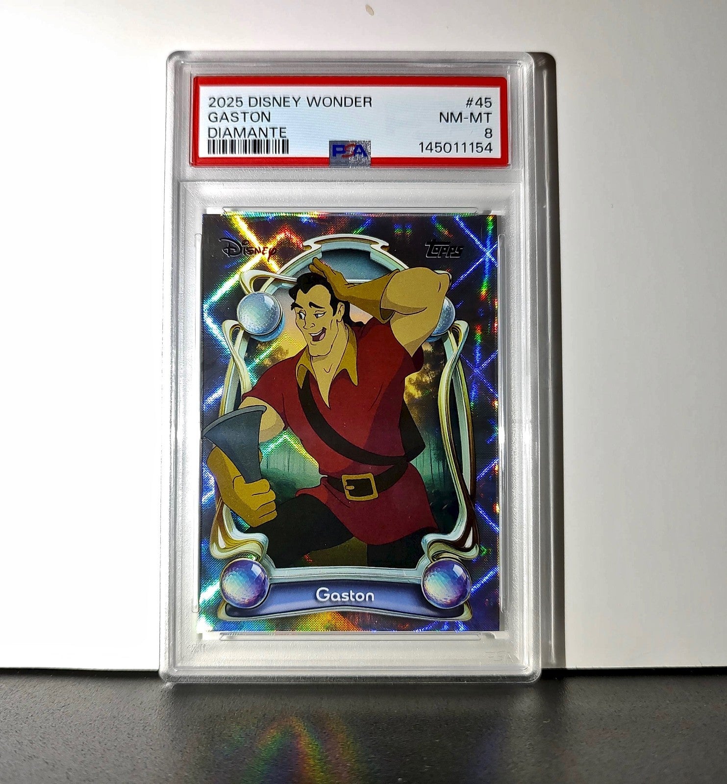Gaston 2025 Topps Disney #45 Winter Variant Card Beauty and the Beast PSA 8