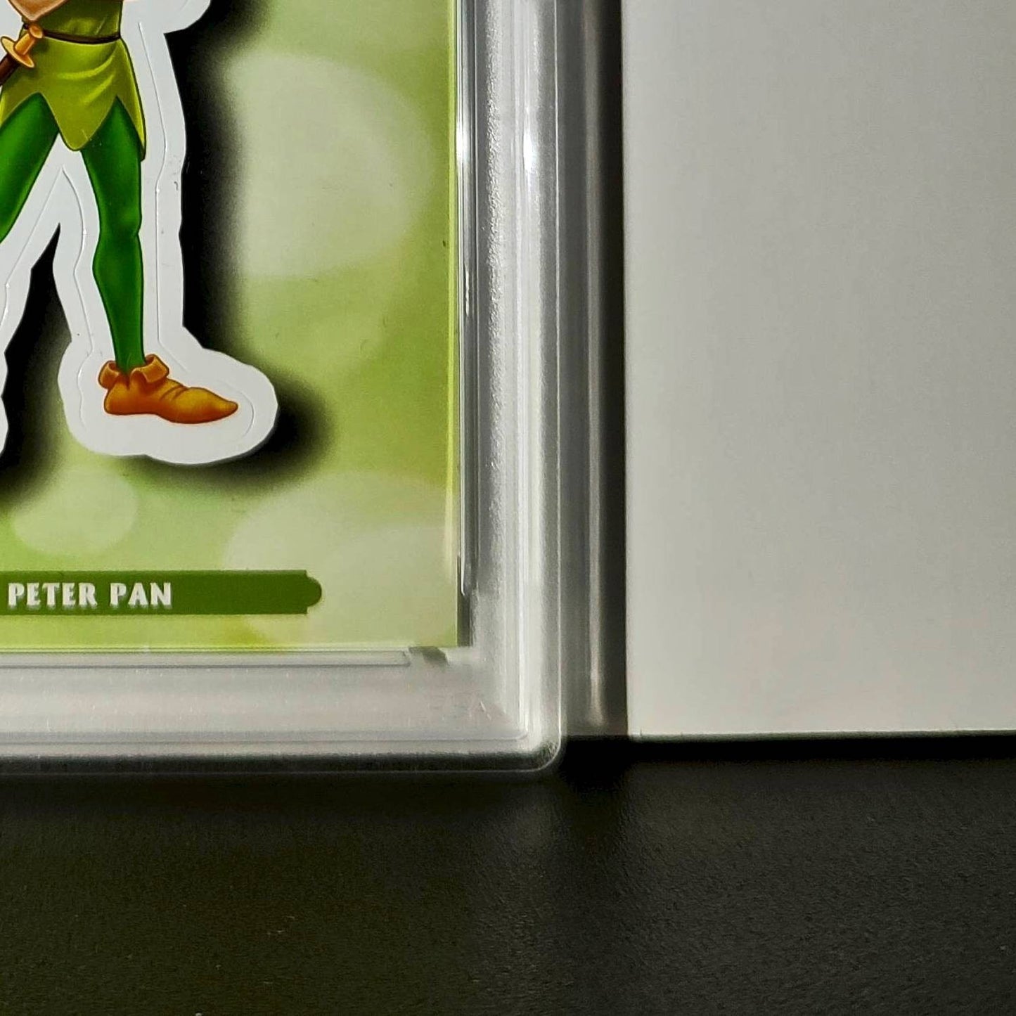 Peter Pan 2025 Topps Disney #ES-8 Enchanted Sticker Card Peter Pan PSA 8