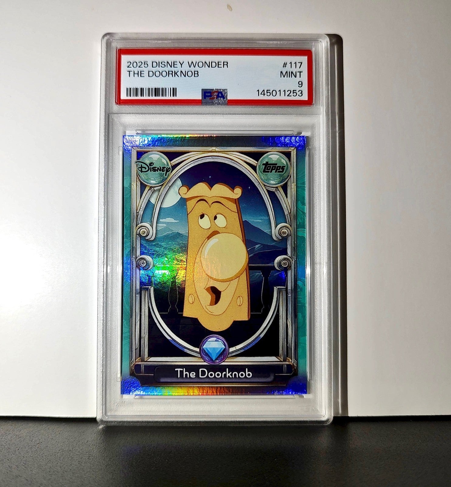 The Doorknob 2025 Topps Disney #117 Diamond Card Alice in Wonderland PSA 9
