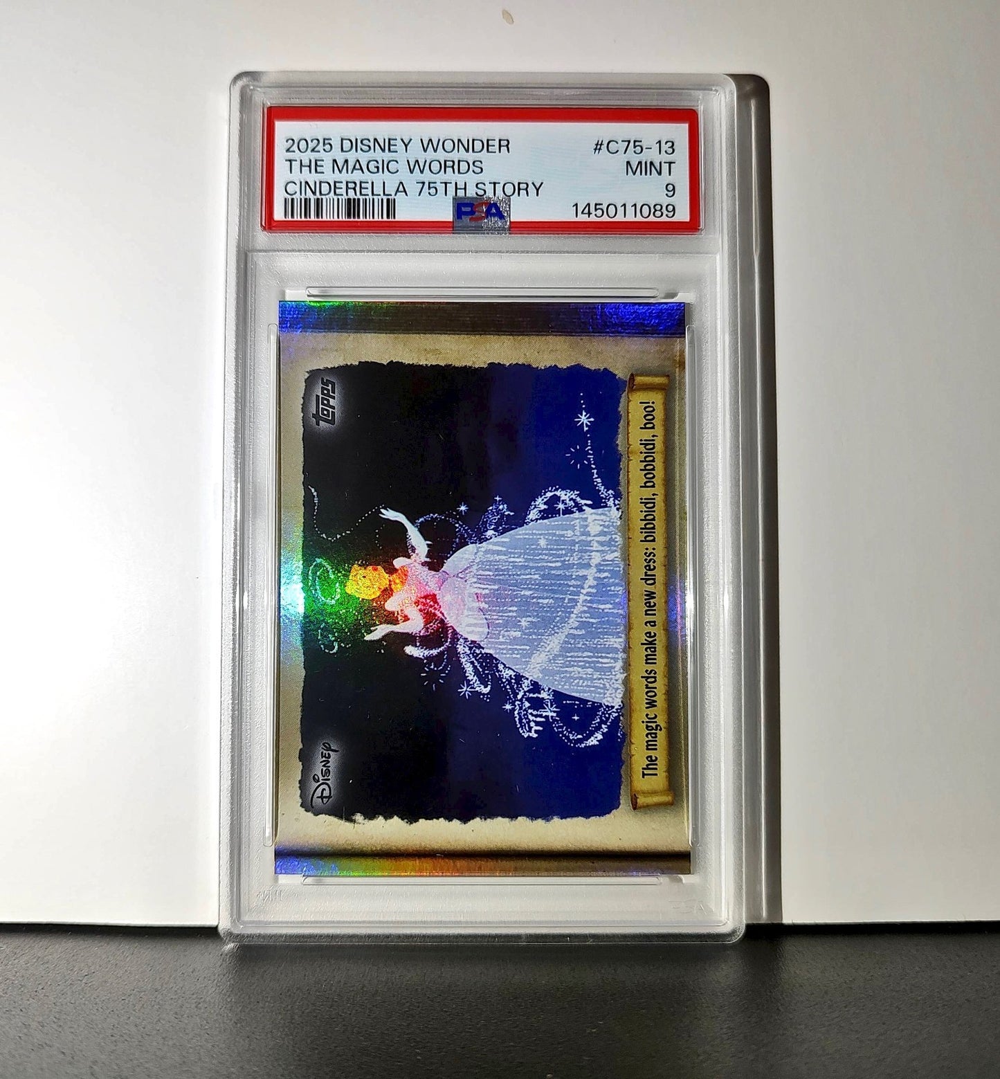 The magic words make a new dress! 2025 Topps Disney #C75-13 PSA 9