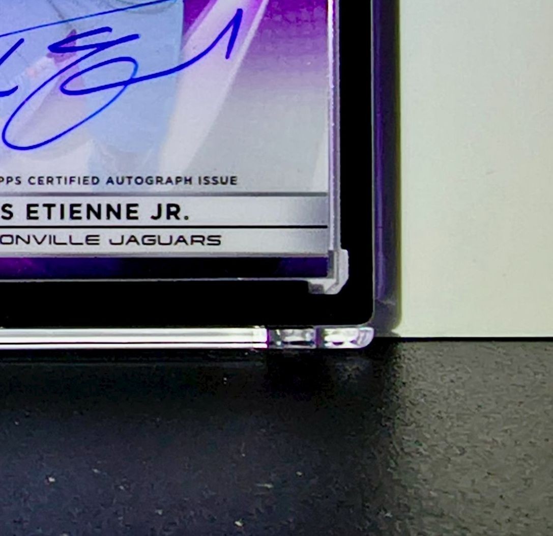 Travis Etienne Jr. 2025 NFL Topps Chrome Black #AU-TE Purple Refractor 58/75