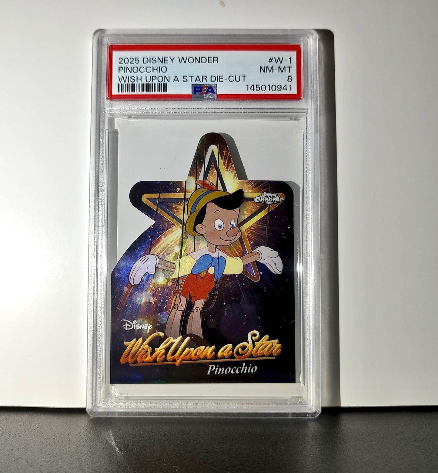 Pinocchio 2025 Topps Chrome Disney #W-1 Wish Upon A Star Die Cut Pinocchio PSA 8