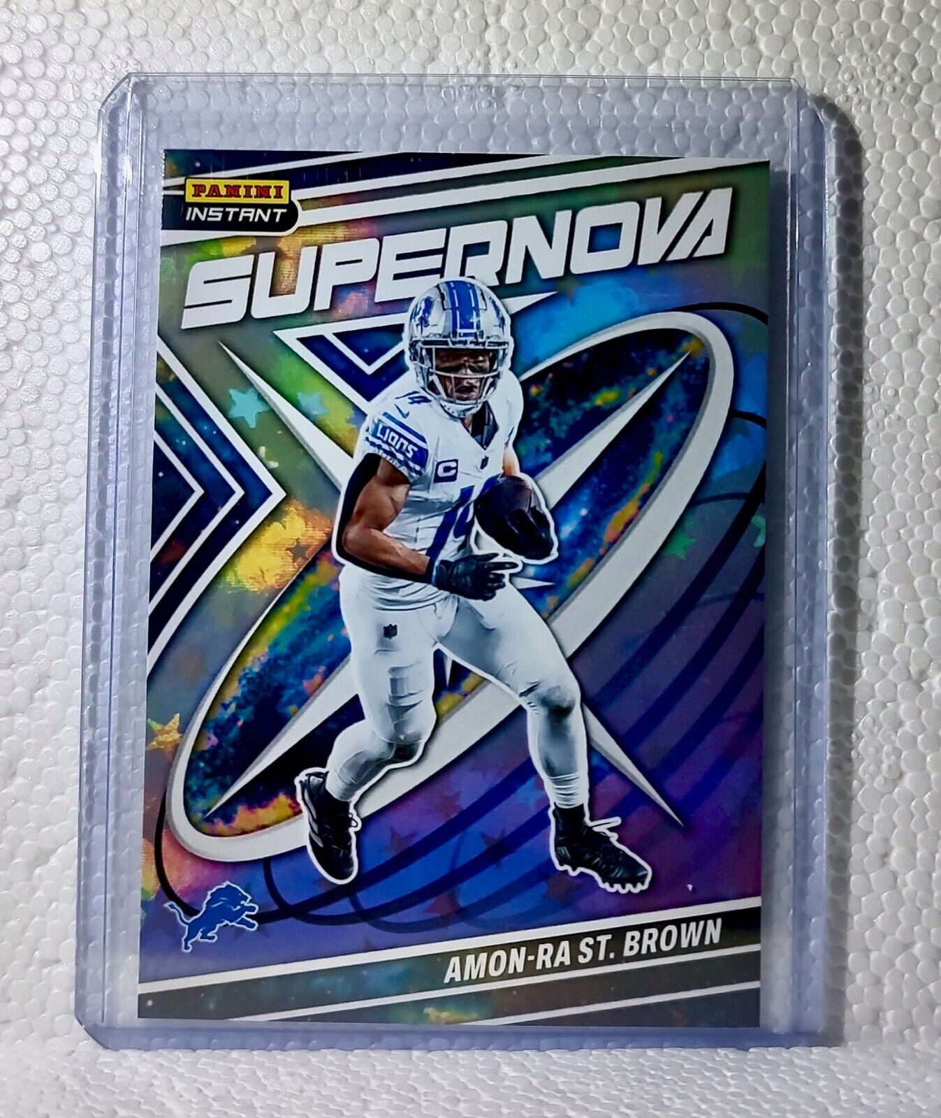 Amon-Ra St. Brown 2023 Panini NFL #18 Supernova Football Card Lions 1/481