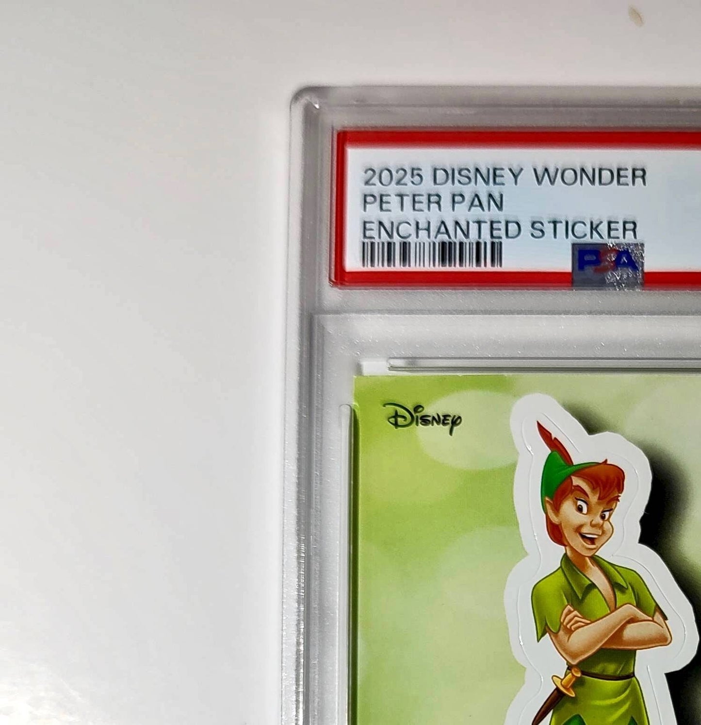 Peter Pan 2025 Topps Disney #ES-8 Enchanted Sticker Card Peter Pan PSA 8