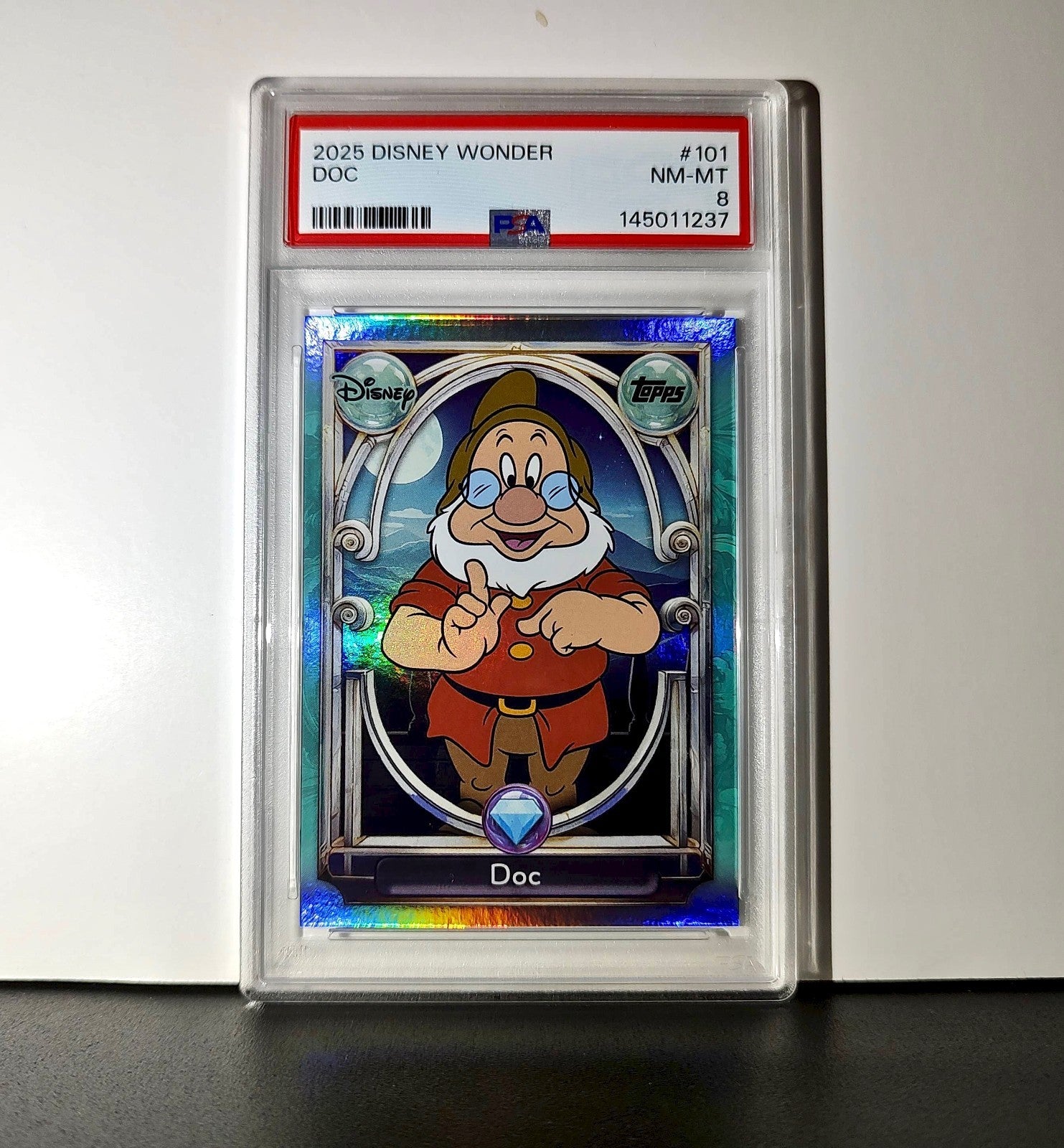 Doc 2025 Topps Disney #101 Diamond Card Snow White and the Seven Dwarfs PSA 8