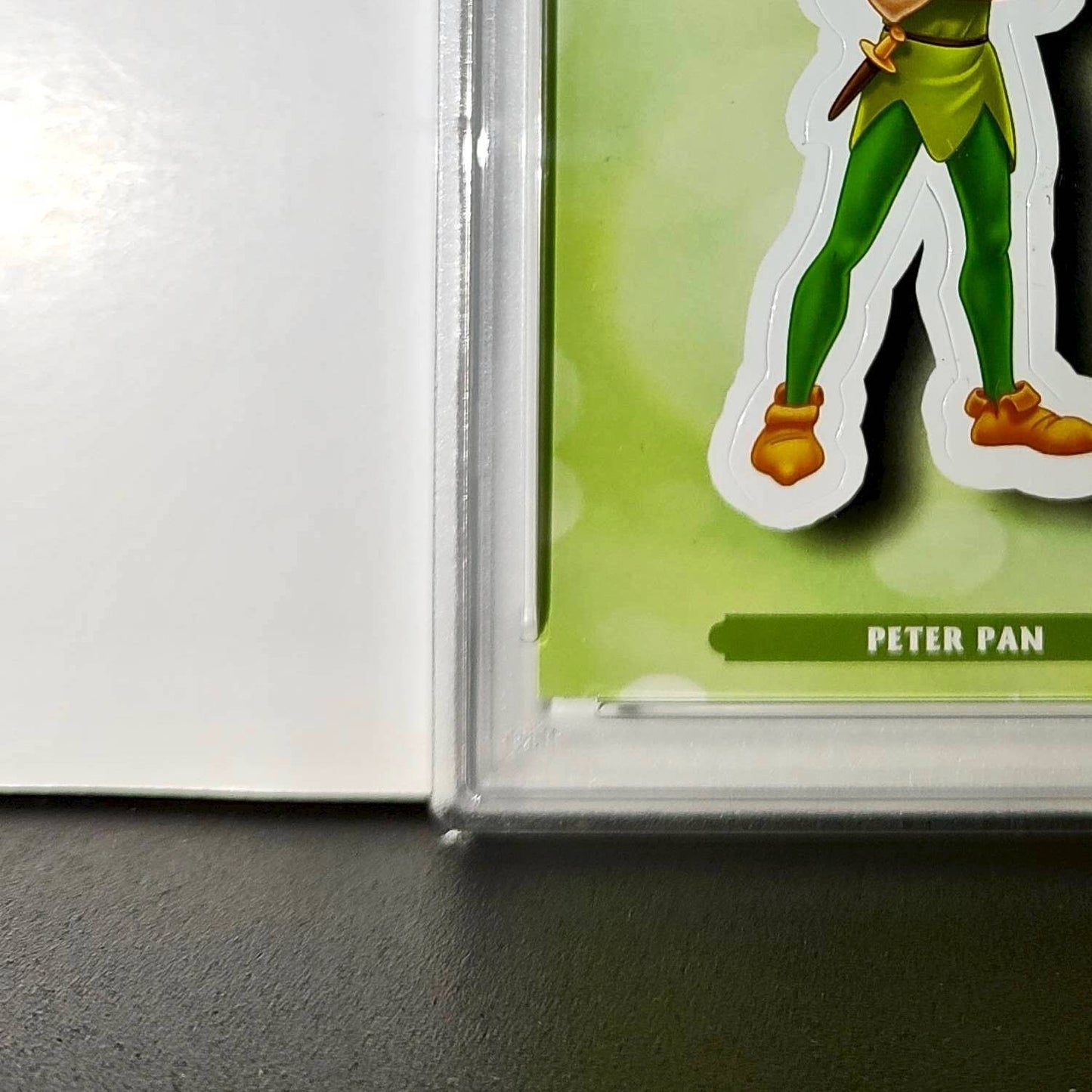 Peter Pan 2025 Topps Disney #ES-8 Enchanted Sticker Card Peter Pan PSA 8