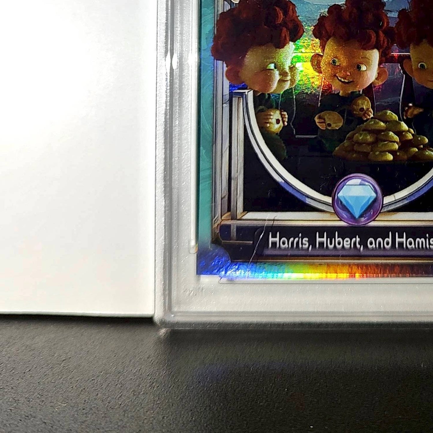 Harris, Hubert, and Hamish 2025 Topps Disney #147 Diamond Card Brave PSA 8