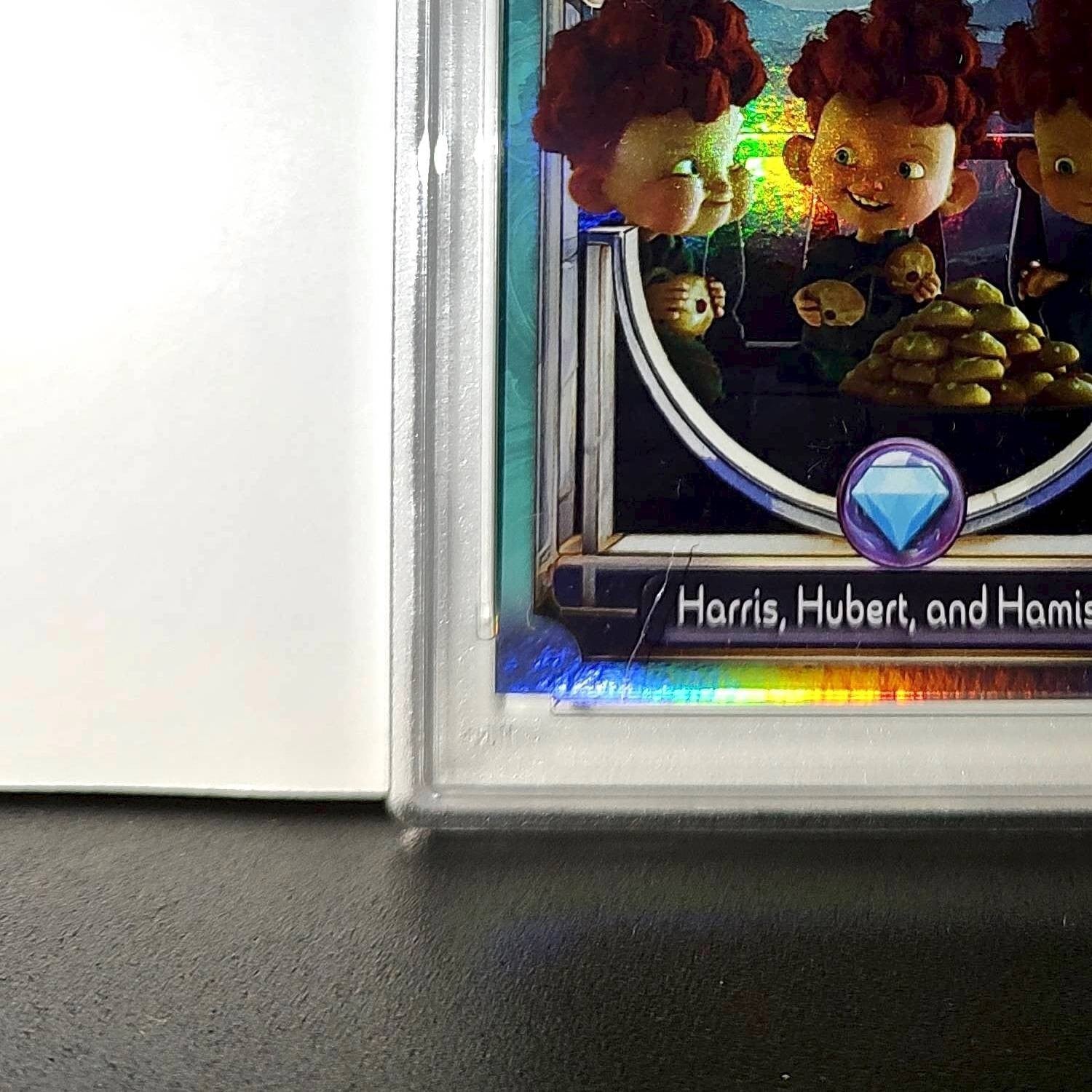 Harris, Hubert, and Hamish 2025 Topps Disney #147 Diamond Card Brave PSA 8