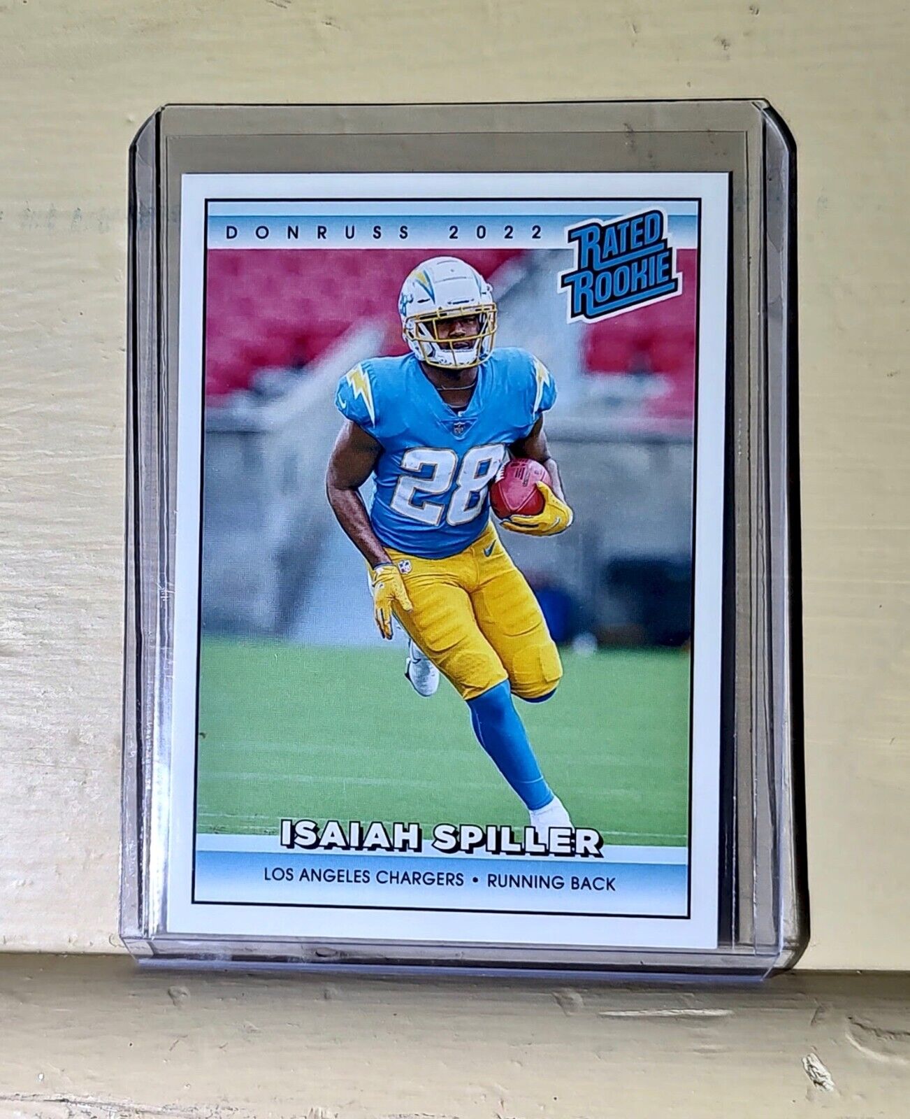 Isaiah Spiller 2022 NFL Panini #34 Rated Rookie Retro Football Card 1/4094