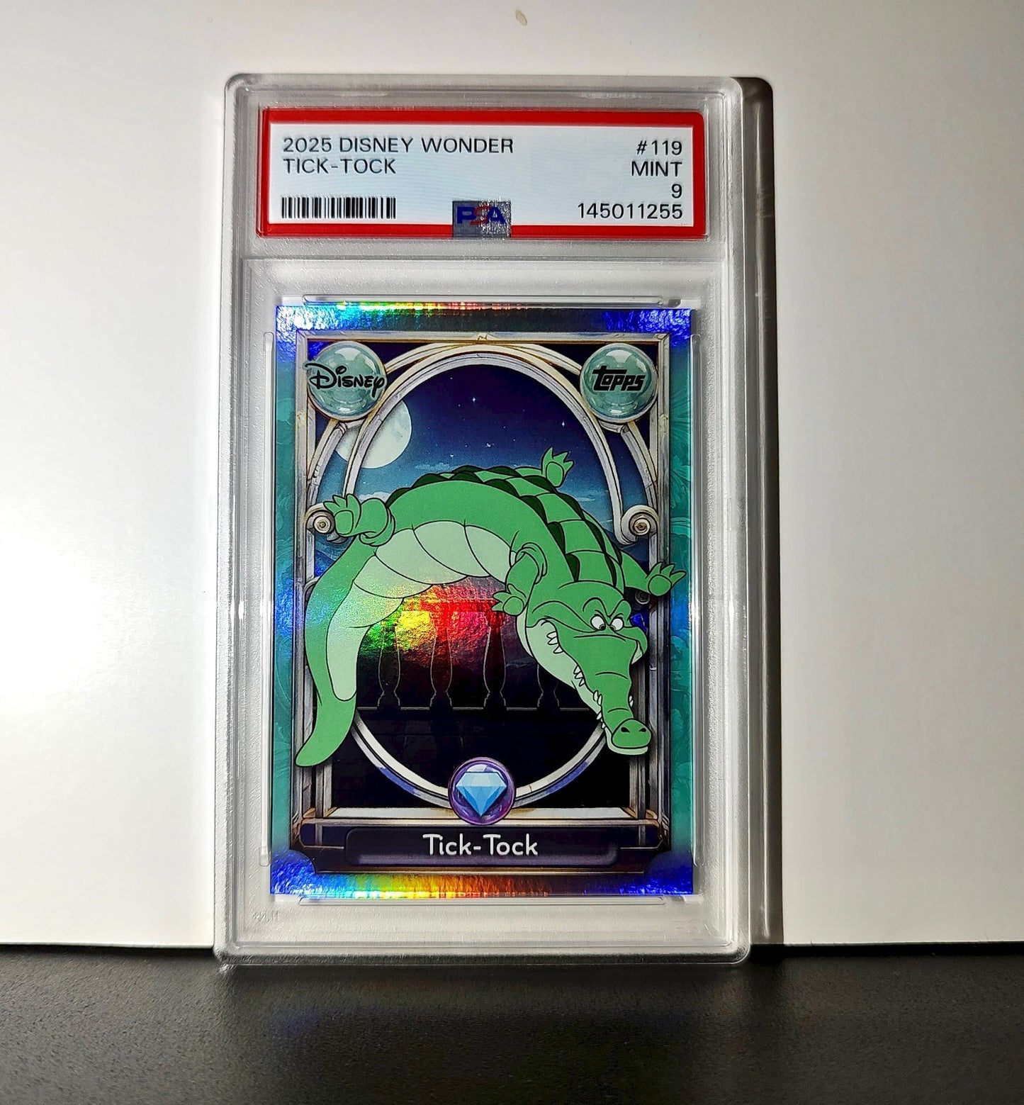 Tick-Tock 2025 Topps Disney Wonder #119 Diamond Card Peter Pan PSA 9