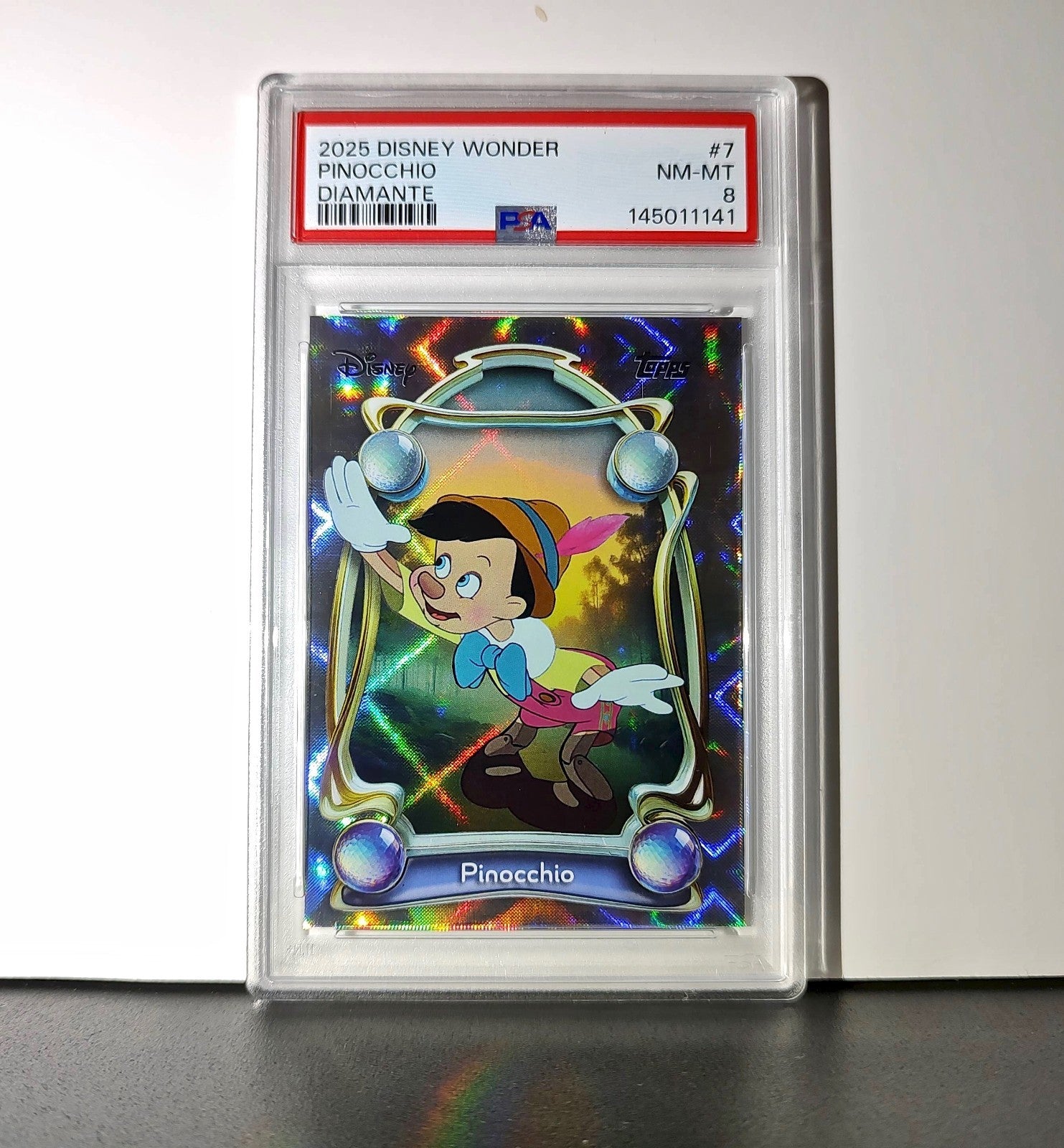 Pinocchio 2025 Topps Disney Wonder #7 Winter Variant Card Pinocchio PSA 8