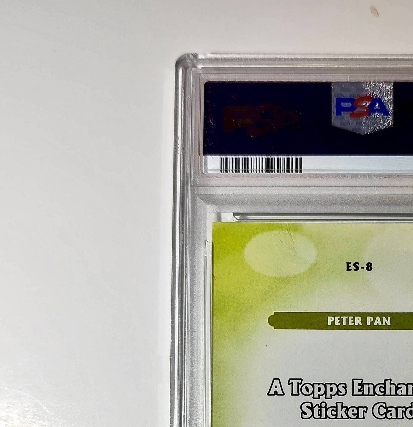 Peter Pan 2025 Topps Disney #ES-8 Enchanted Sticker Card Peter Pan PSA 8